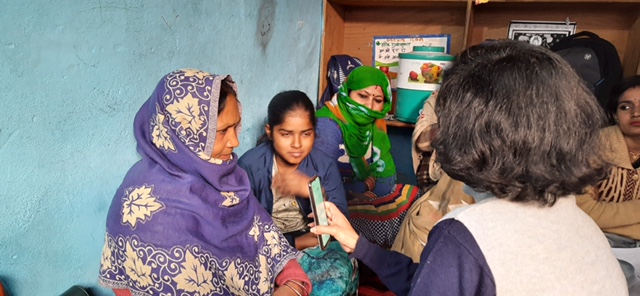 "A participant being interviewed by a researcher"